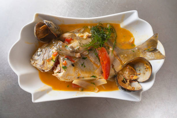 Peruvian food: sweaty or fish soup stock photo