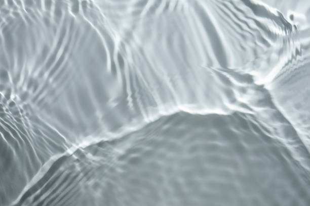 istock Clear light transparent water cosmetic dark grey gel tonic multi-colored background 1218226317