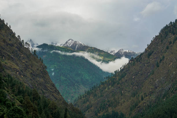istock Stunning Mountain View, Top covered with Snow. Peak Above Clouds 1218226632
