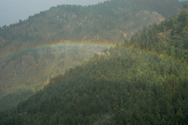 istock Rainbow View in Mountains Sunny and Cloudy Weather Himachal India 1218226718