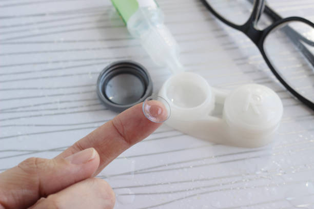 istock Female finger with contact lens 1218226723