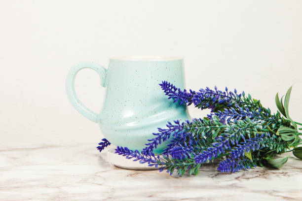 istock Lavender flowers and pastel blue mug on a marble table 1218229600