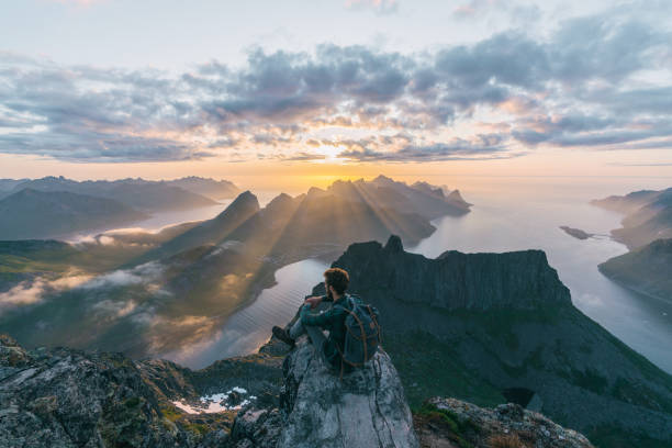 istock Young Caucasian man  looking at Senja island 1218230246
