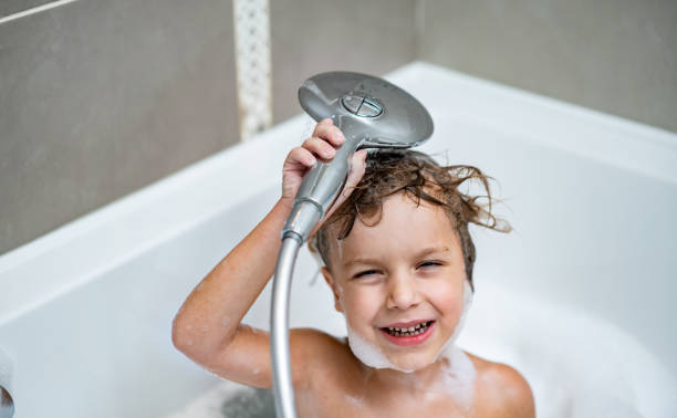 istock Cute boy shower his head 1218230885