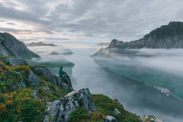 istock Man hiking in mountain on Senja island 1218231712