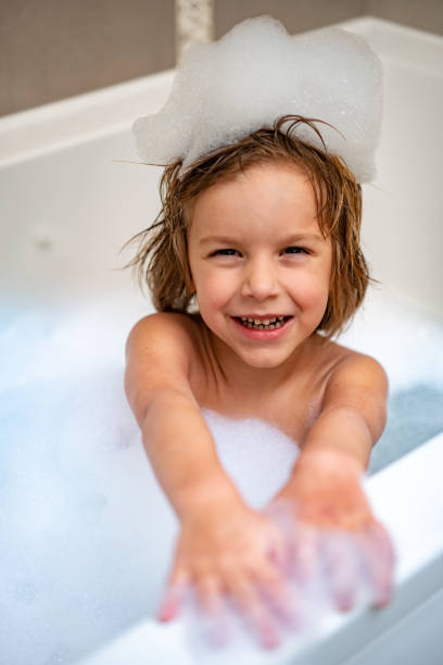 istock Cute boy with foam on his head 1218231785
