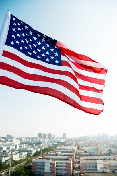 istock Waving American flag and building 1218231961