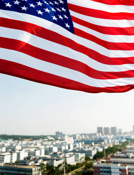 istock Waving American flag and building 1218231962