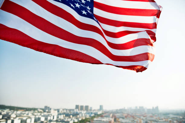 istock Waving American flag and building 1218232021
