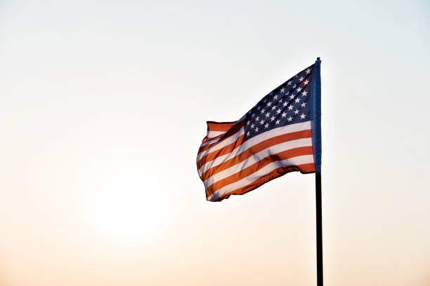 istock American flag waving in sunset 1218232023