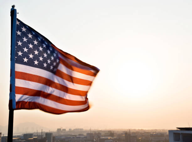istock American flag waving in sunset 1218232127