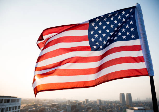 istock American flag waving in sunset 1218232181