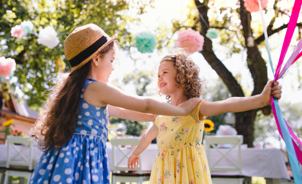 istock Small children outdoors in garden in summer, playing. 1218232539
