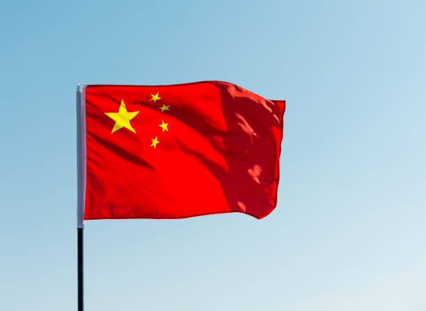 istock China flag waving against blue sky 1218232930