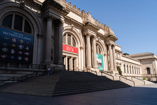 Manhattan, New York, NY, USA - April 6, 2020: A single person exercising on the abandoned staircase of the Metropolitan Museum of Art which is closed due to the COVID-19 outbreak.