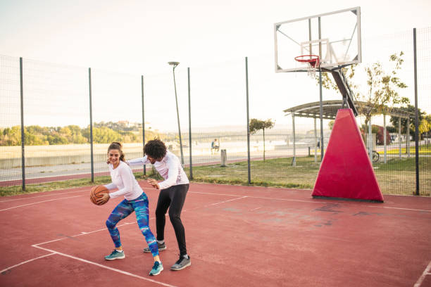 istock Friends playing basketball one on one 1218233093