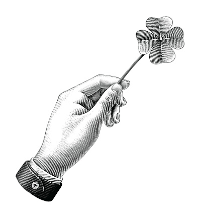 Hand hold clover leaf drawing vintage style black and white clipart isolated on white background