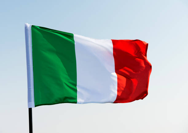 Italian flag waving in the sky.