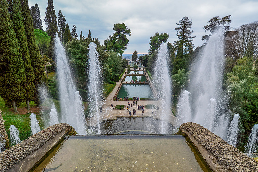 Tivoli, Lazio, Italy - March 10, 2019: From the top of the villa you overlook the most impressive and scenic fountain of the villa. the Fountain of Neptune, a harmonious composition that develops slowly from the base, and intensifies gently, to liven up more in the upper part and explode towards the sky