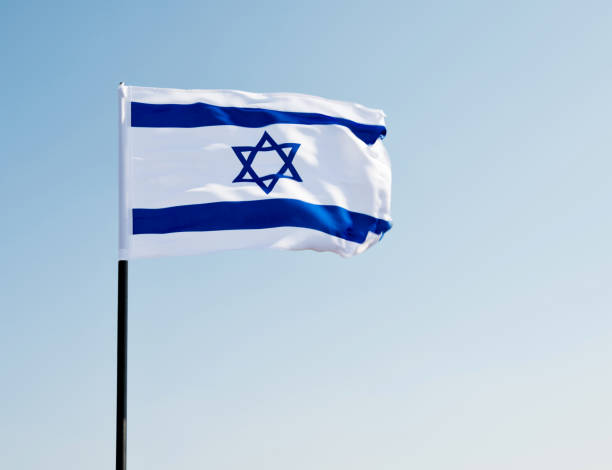 istock Israel's national flag in the wind 1218234307