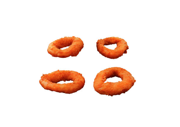 Six onion rings stacked in white background. The Background is slightly reflective and also the rings' shadow is cast on it