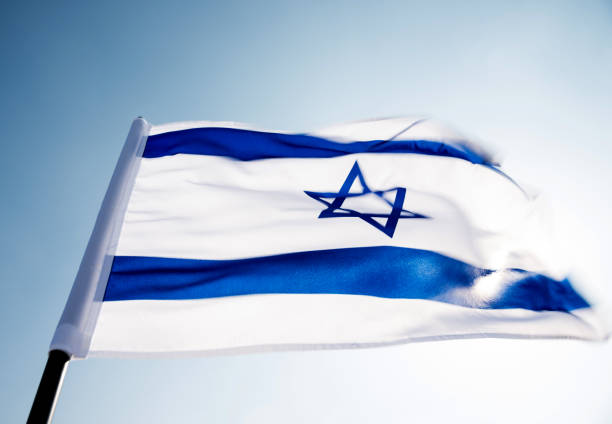 istock Israel's national flag in the wind 1218234811