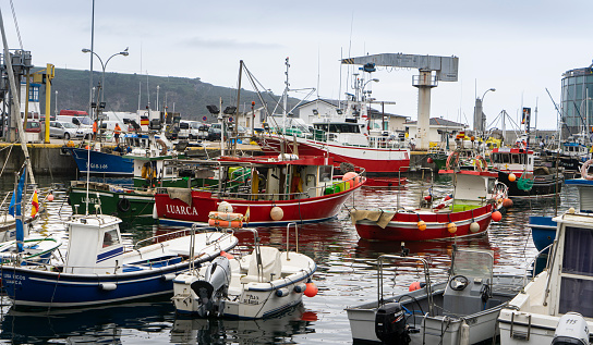 View of the port of Luarca with many recreational and fishing boats.