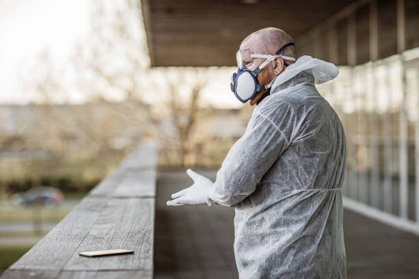 A male essential worker wearing a face mask during virus outbreak