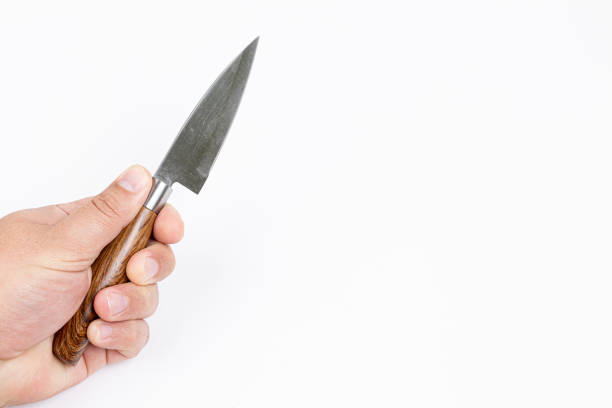 Knife in the hand isolated white background copy space.