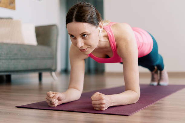 istock Caucasian woman practicing yoga at home 1218239533