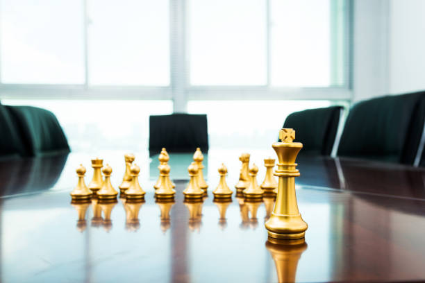 istock Golden pieces on the conference table 1218241633