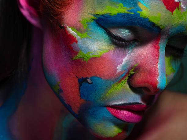 istock Multicolored skin, difficult to identify. Creative makeup and drawing on the face. 1218243752