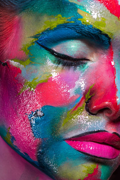 istock Multicolored skin, difficult to identify. Creative makeup and drawing on the face. 1218243769