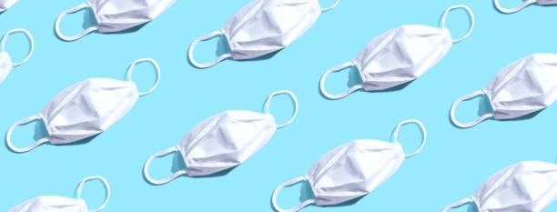 istock White surgical masks overhead view 1218245313