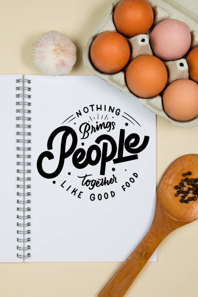istock Wooden ladles with spices, eggs and garlic with a blank notebook page 1218245668
