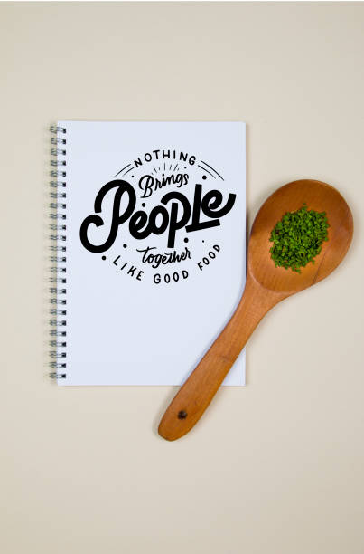 istock Wooden ladle with some herb spice and a blank notebook page 1218245765