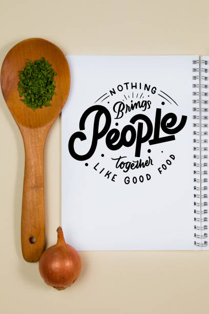 istock Wooden ladle with some herb spice and a blank notebook page 1218245766