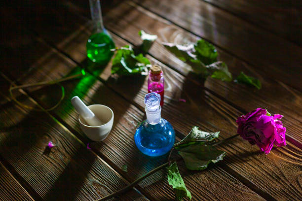 istock Witchcraft. Witch doctor desk table. Magic potion. ALternative medicine concept. Divination, love potion. Mysterious clouds of smoke 1218245826
