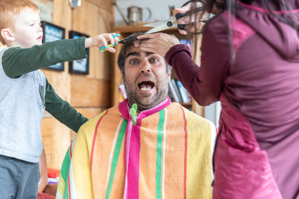 istock Father getting an haircut at home during stay at home order 1218249447