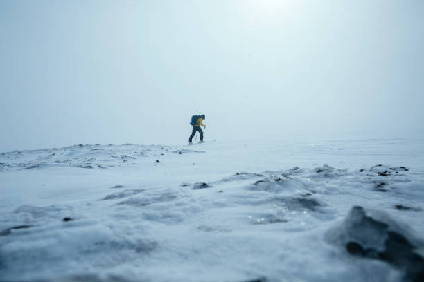 Solitary man skiing on a winter landscape