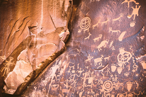 pictographs on a rock wall panel near Moab Utah called Newspaper rock
