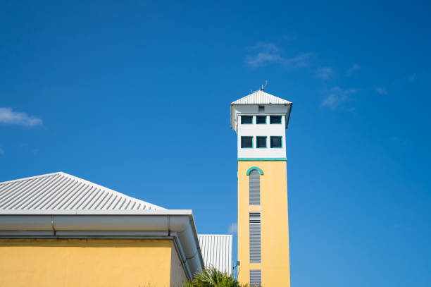 House with tower on sunny blue sky. Architecture, structure and design concept.