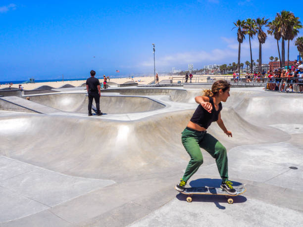 Skaters are training at the skatepark of Venice beach in July 2019 in Los Angeles