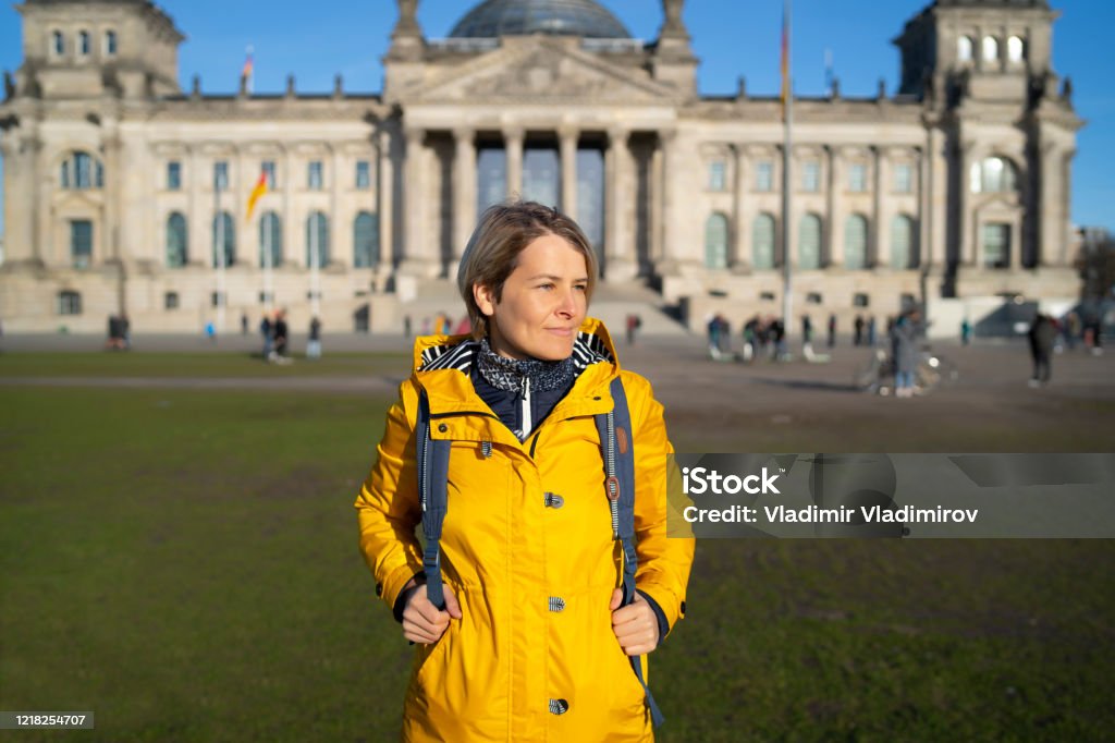 Tourist woman in Berlin Tourist woman standing in front of Reichstag in Berlin Backpack Stock Photo