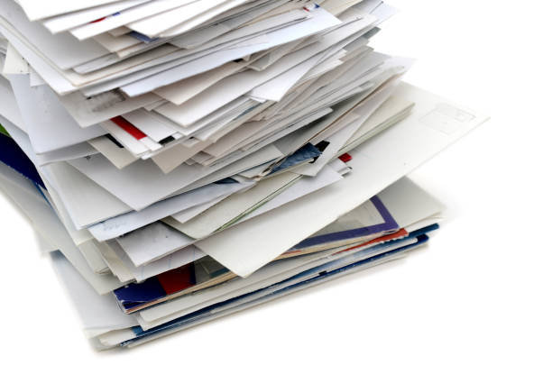 istock Stacking of letter mails on white 1218254743