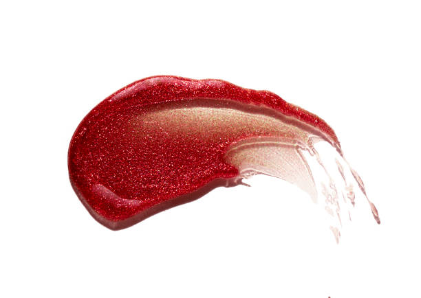 Brown bronze dark red shimmering lip gloss on white background