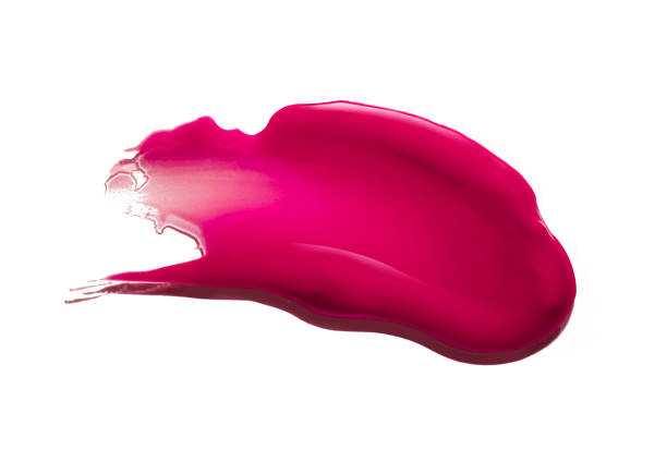 istock Pink purple dark red shimmering lip gloss on white background 1218255969
