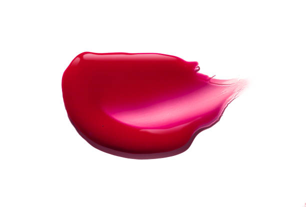 istock Pink purple dark red shimmering lip gloss on white background 1218256033
