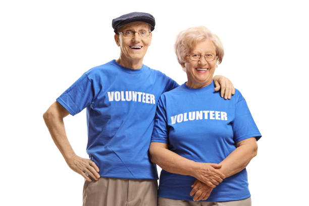istock Senior volunteers smiling at the camera 1218257500