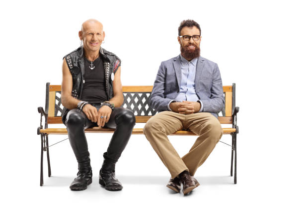 istock Bald punk and bearded man sitting on a bench 1218259446